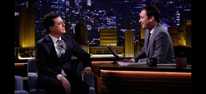 Jimmy Fallon and Stephen Colbert sitting and staring