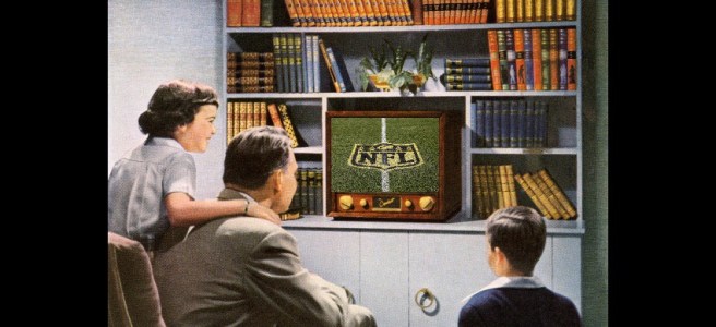 Family watching baseball on tv