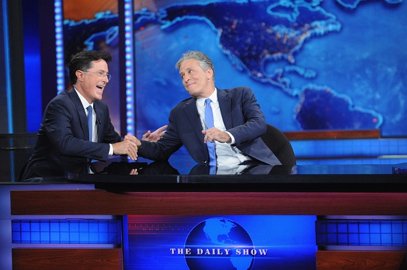 NEW YORK, NY - AUGUST 06: Stephen Colbert and Jon Stewart appear on "The Daily Show with Jon Stewart" #JonVoyage on August 6, 2015 in New York City. (Photo by Brad Barket/Getty Images for Comedy Central)