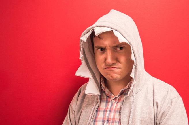 grumpy man wearing shark hoodie