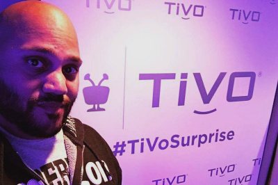 vlogger Andru Edwards next to tivo surprise background
